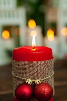 Candle for Christmas in red. Beautiful Holidays decoration