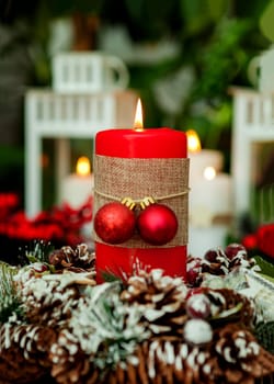 Candle for Christmas in red. Beautiful Holidays decoration