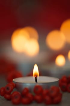 Christmas candles with berries. Decoration for holidays