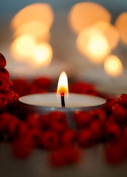 Christmas candles with berries. Decoration for holidays