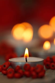 Christmas candles with berries. Decoration for holidays