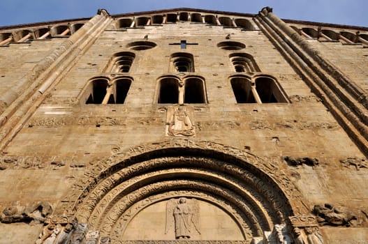 detail of romanesque main facade of the famous church  in city center, shot in bright light.