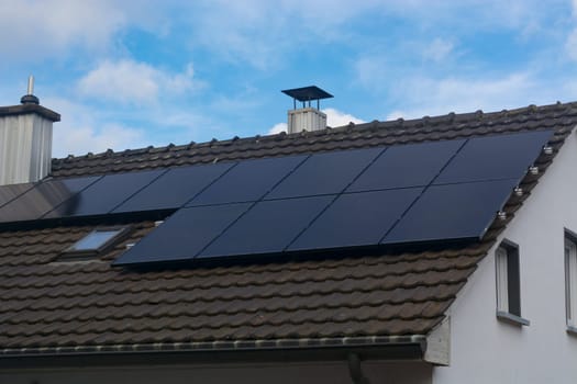 Modern house with a photovoltaic system, solar panels for electricity generation