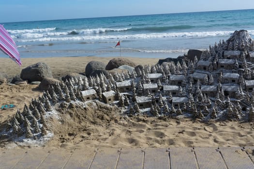Christmas Village of sand on the beach of Cran Canaria in Meloneras