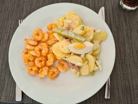 Traditional German potato salad with crabs
