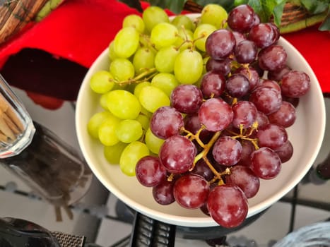 Green and rose grapes background