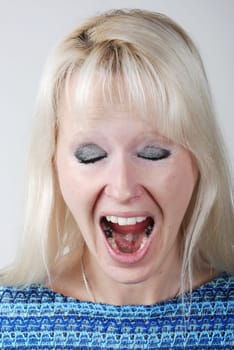 Young blonde woman with a cry