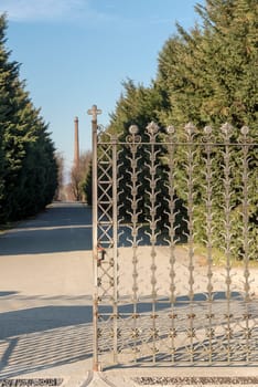 decorated iron gate at historical industrial village, shot in winter at Crespi Adda, Capriate, Lombardy, Italy.