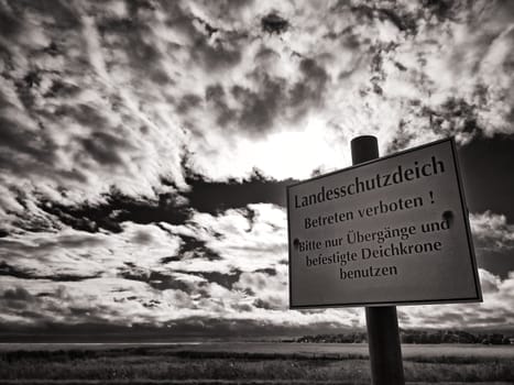 Warning sign on protective dike, Mecklenburg Baltic Sea coast