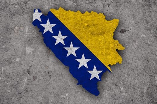 Map and flag of Bosnia and Herzegovina on weathered concrete