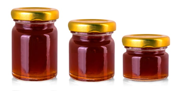 The small glass jars with jam isolated on white background