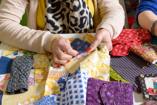 close-up of the hands of a seamstress in her workshop