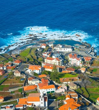 Aerial view of Porto Moniz town, famous for its natural volcanic lava pools. Madeira