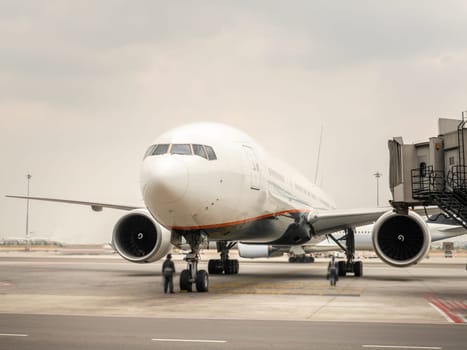 Airplane near the terminal in an airport cockpit