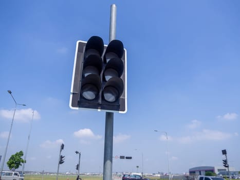 the traffic lights against a vibrant blue sky