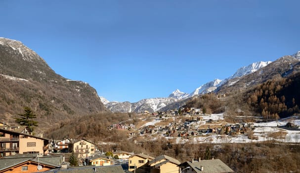view of small touristic village, shot in bright winter light at Caspoggio,  Valtellina, Lombardy, Italy.