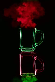 Just a glass on a black background with a reflection. Red and green, with steam. Isolated.