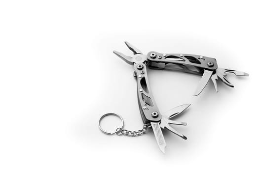 Multi tool with expanded tools and pliers isolated on a white background. Free space for the label or logo, layout, mockup.