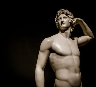 MILAN, ITALY - June 2020:  the ancient sculpture Apollo Crowning Himself - 1782 - Antonio Canova's masterpiece. Intesa Italian Museum.