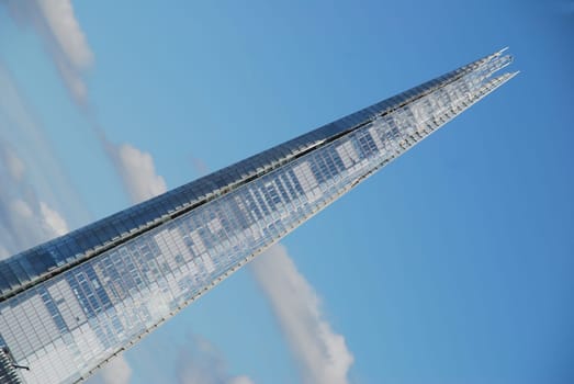 "The Shard"" a modern modern skyscraper in London opposite the Tower of London on the River Thames."