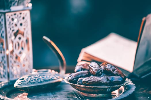 Festive greeting card for Muslim holy month Ramadan Kareem with dates, Quaran and censer