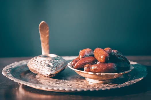 Festive greeting card for Muslim holy month Ramadan Kareem with dates, Quaran and censer
