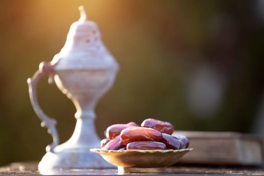 Festive greeting card for Muslim holy month Ramadan Kareem with dates, Quaran and censer