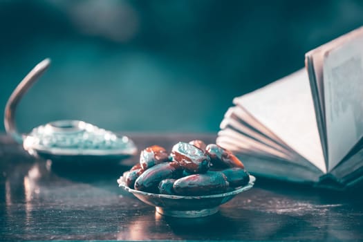 Festive greeting card for Muslim holy month Ramadan Kareem with dates, Quaran and censer