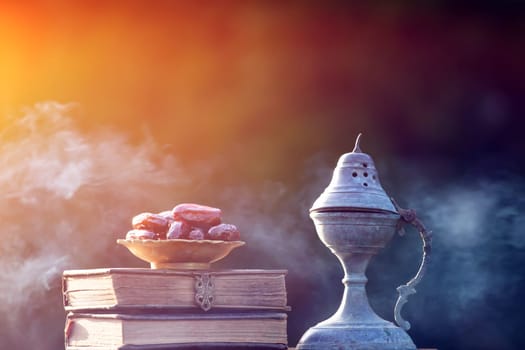 Festive greeting card for Muslim holy month Ramadan Kareem with dates, Quaran and censer