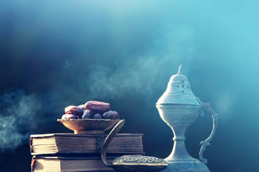 Festive greeting card for Muslim holy month Ramadan Kareem with dates, Quaran and censer