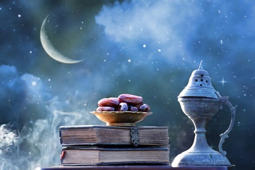 Festive greeting card for Muslim holy month Ramadan Kareem with dates, Quaran, censer and crescent moon.
