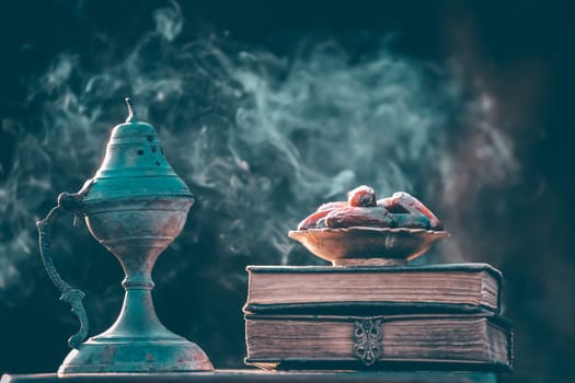 Festive greeting card for Muslim holy month Ramadan Kareem with dates, Quaran and censer