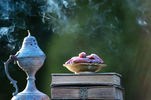 Festive greeting card for Muslim holy month Ramadan Kareem with dates, Quaran and censer