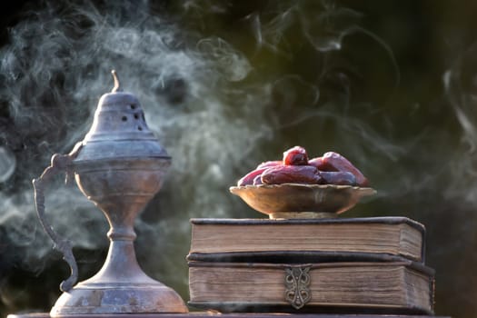 Festive greeting card for Muslim holy month Ramadan Kareem with dates, Quaran and censer