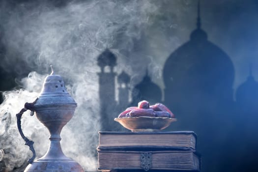 Festive greeting card for Muslim holy month Ramadan Kareem with dates, Quaran and censer