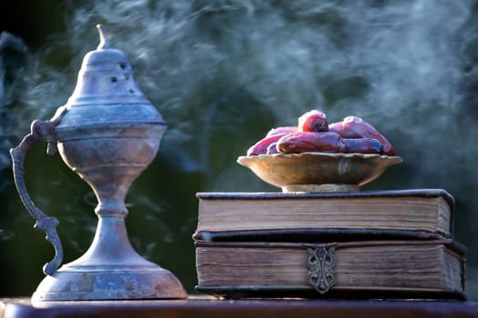 Festive greeting card for Muslim holy month Ramadan Kareem with dates, Quaran and censer