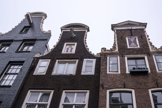 Amsterdam,Netherlands-December 30,2016:The upper parts of buildings, visible console for lifting