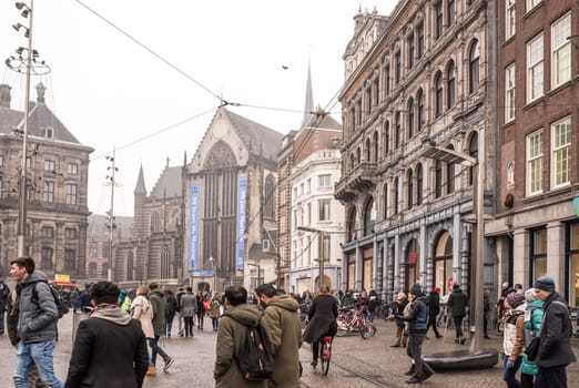 Amsterdam,the Netherlands-December 30,2016:On the street walking people and moving vehicles