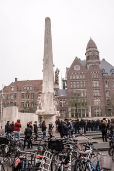 Amsterdam,the Netherlands-December 30,2016:On the street walking people and moving vehicles