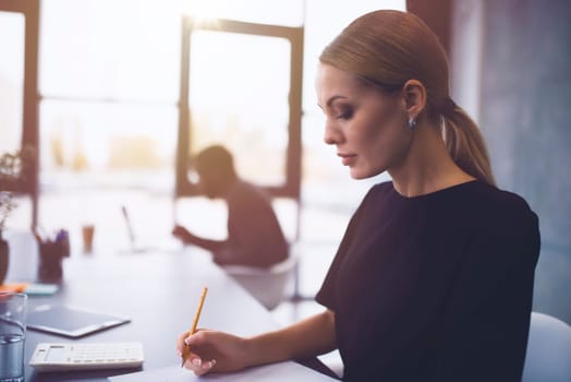 Businesswoman at the office works with a computer with his team