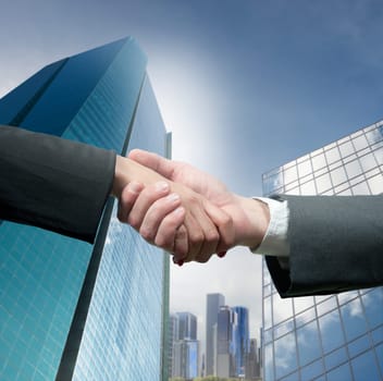 Business people shaking hands over a deal
