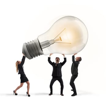 Business people holds a big light bulb. concept of new idea and company startup