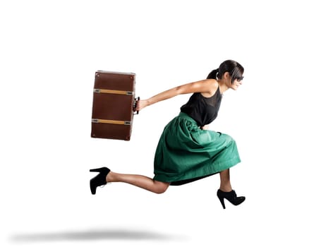 Elegant beautiful woman tourist runs with suitcase