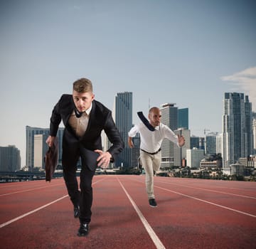 Businessman acts like a runner on a track. Competition and challenge in business concept