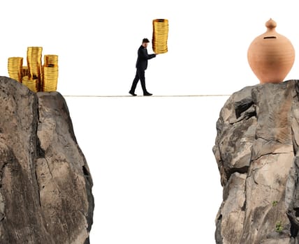 Businessman moves a pile of golden coins to a moneybox. concept of difficulty to saving money