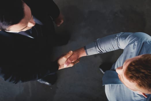 Handshaking business person in the office. concept of teamwork and business partnership