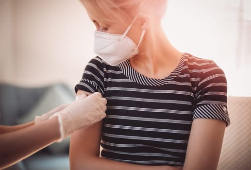Woman and a doctor in the hospital after vaccination against Covid 19. Concept of immunization and making injections from pandemic of SARS.