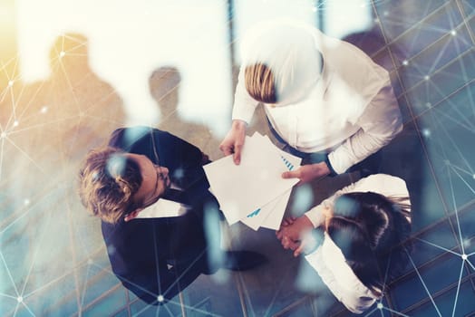 Team of people work together in office about company statistics. Concept of teamwork and partnership. double exposure