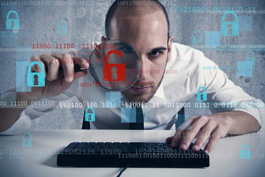 Businessman looking in a computer for virus and hacker