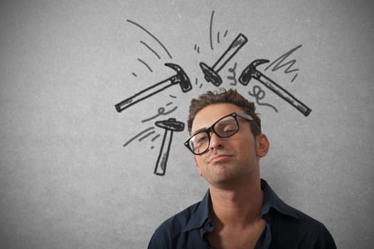 Concept of stressed businessman with hammer